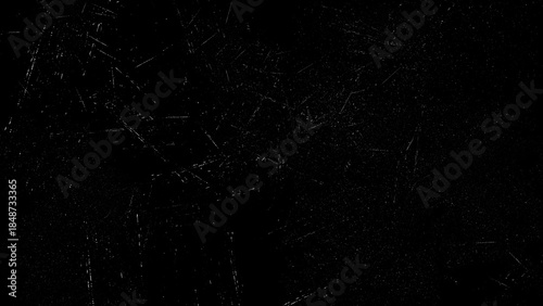 Black grunge texture overlay with white scratches and dust particles
