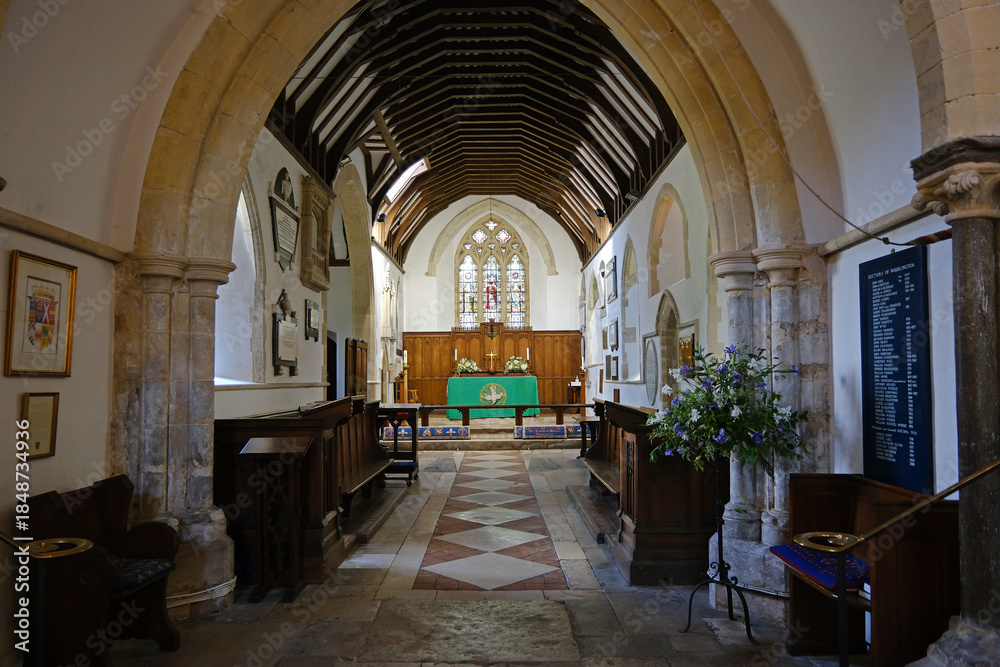 Fototapeta premium View Down the Nave Aisle to the Altar and Chancel of St Thomas à Becket Church