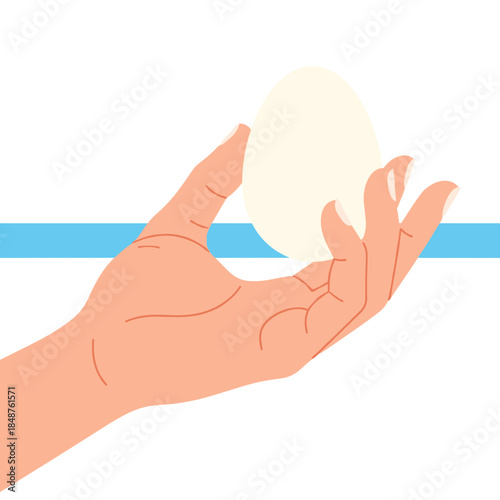 Hand holding peeled hard-boiled egg against blue background  