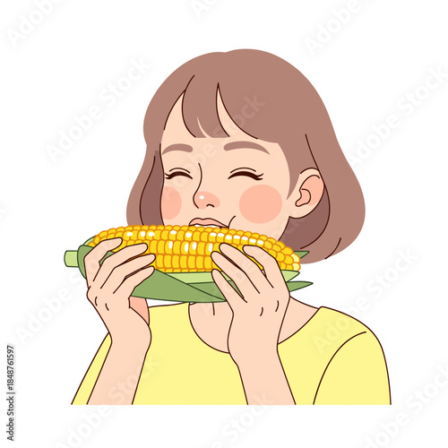 Girl enjoying boiled corn with a joyful expression on her face  