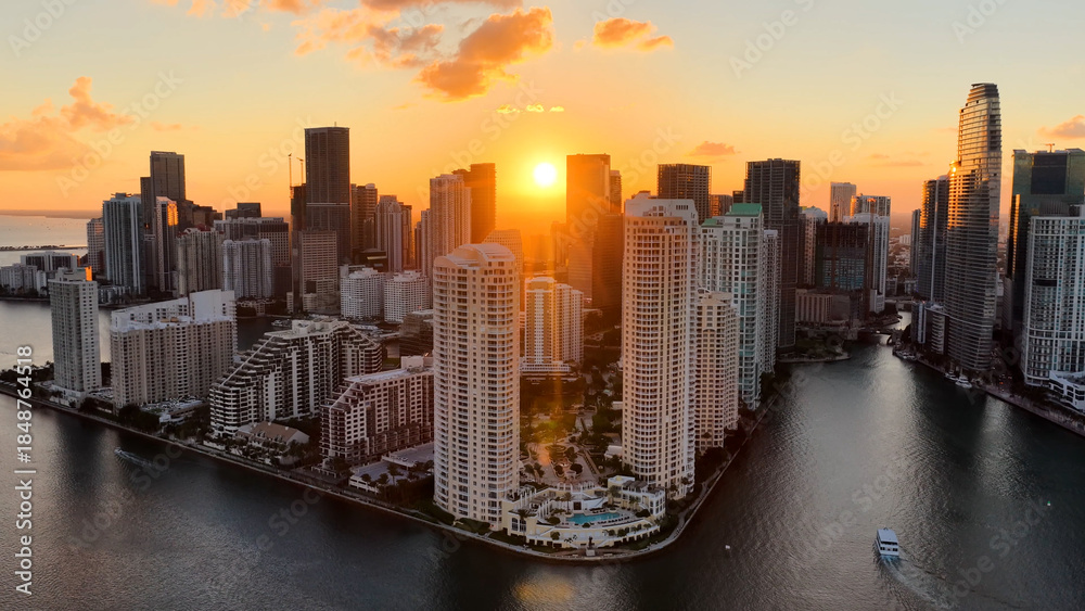 Fototapeta premium Miami Beach Skyline At Miami Beach In Florida United States. Sunset Biscayne Bay. Illuminated Cityscape. Downtown City. Miami Beach Skyline At Miami Beach In Florida United States. Amazing Sunset Sky.