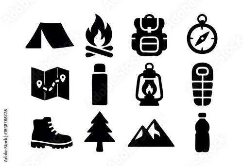 A collection of black silhouette icons representing essential camping, hiking, and outdoor adventure gear and elements on a white background — stock vector.