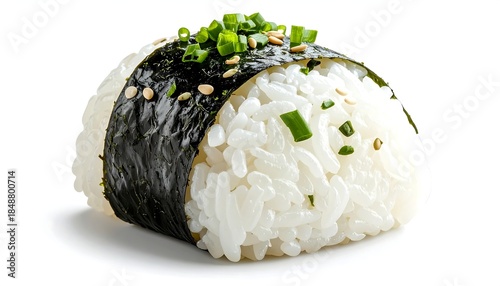 Triangular rice ball, wrapped with seaweed and topped with chopped green onions and sesame seeds on white backdrop