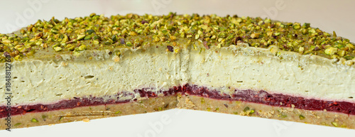 Delicious cheesecake with raspberries and pistachios