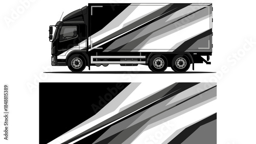 Modern black and silver semi truck with streamlined trailer on highway.