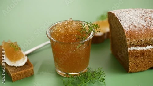 Tasty golden caviar snack featuring rustic bread and aromatic dill sprigs