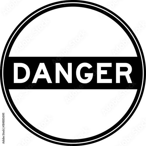 Black color round seal sticker in word danger on white background