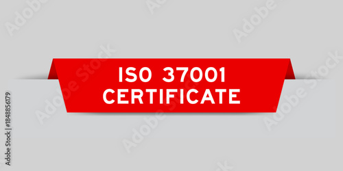 Red color inserted label with word ISO 37001 certificate on gray background