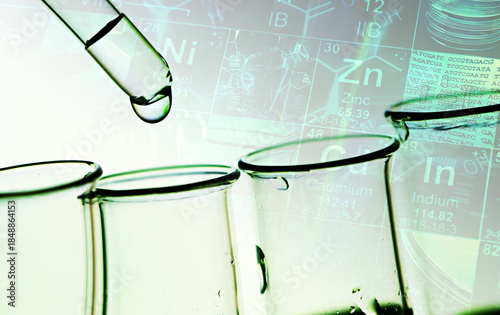 Pipette and test tubes in green tone.