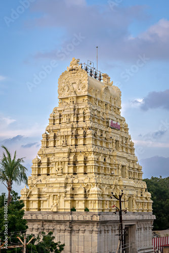 Gopuram of Western gate of Ramanatha Swamy temple with nice blue colored sky background, in Rameswaram, Tamil Nadu, India. Text in local tamil language means Gods name'Shiva Shiva.