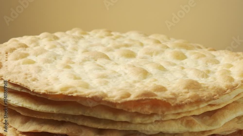 Stack of Baked Cake Layers Rotating: Close-up of crispy golden puff pastry crusts for traditional Napoleon cake or mille-feuille dessert