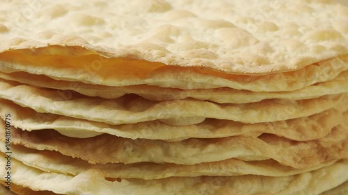 Stack of Baked Cake Layers Rotating: Close-up of crispy golden puff pastry crusts for traditional Napoleon cake or mille-feuille dessert
