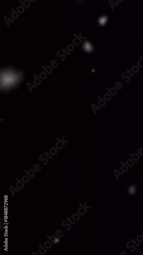 snow falling on black background for christmas