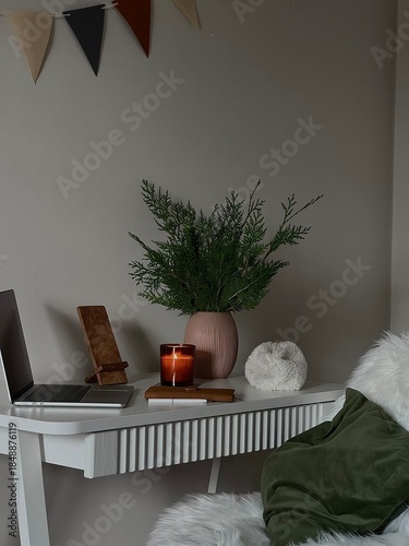 Cozy Reading Nook With Potted Plant. Soft Blanket Draped Over Plush Armchair, Ceramic Shell Beside Stacked Books, Flickering Candle And Evergreen