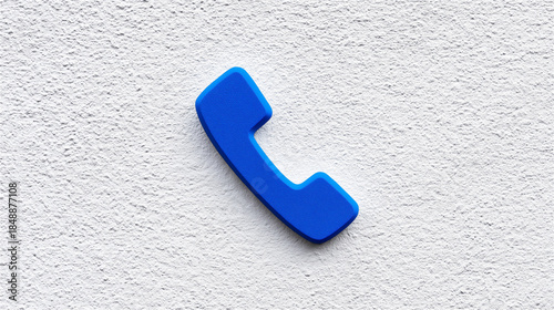 Blue phone receiver icon on textured white background, minimal communication and customer support concept for apps, websites, hotlines, contact pages, or emergency services with copy space.