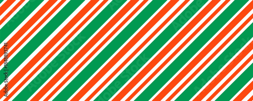 Christmas seamless pattern. Red and green diagonal stripes background. Candy cane repeating decoration wallpaper. Winter holiday lines backdrop. Xmas peppermint present wrapping print design. Vector