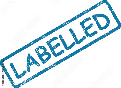 Distressed blue rubber stamp clearly displays the important message LABELLED on a clean white surface