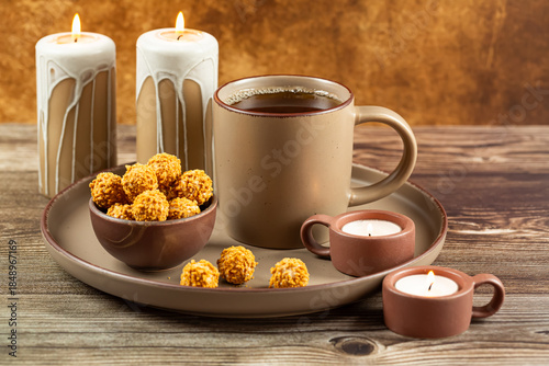 Cup of tea, candies and candles