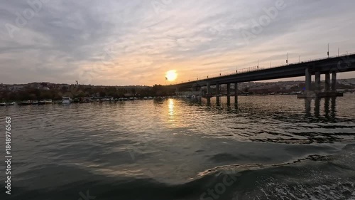 View of The Golden Horn Bridge in a boat in Istanbul at a beautiful sunset