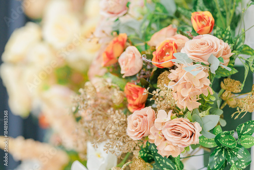 Fresh and Vibrant Floral Arrangement with Varied Roses, Greenery, and Decorative Accents for Home and Event Decor
