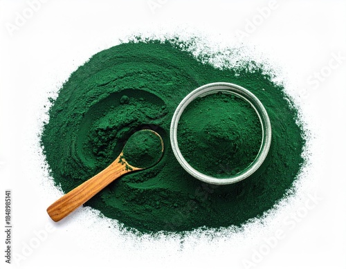 Green powder with bowl and spoon, isolated on white