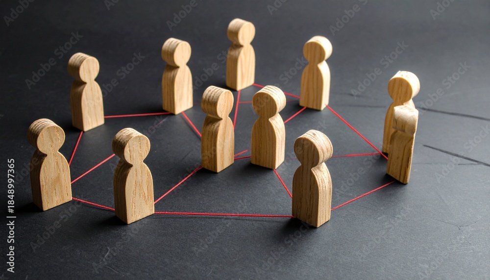 Obraz premium Wooden peg people connected by red strings representing social networking team collaboration and professional community links