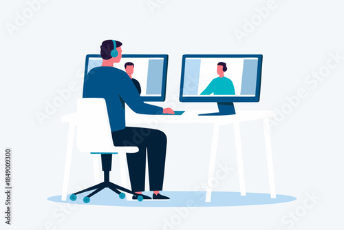 Man using dual monitors for a video conference call at his desk