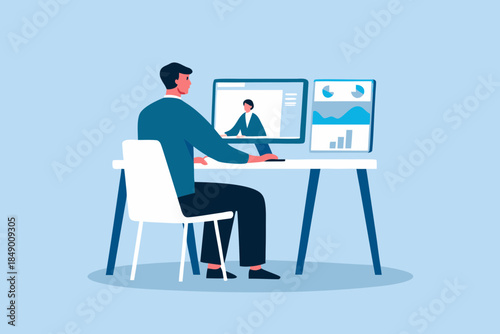 A man participates in a video conference while working at a desk