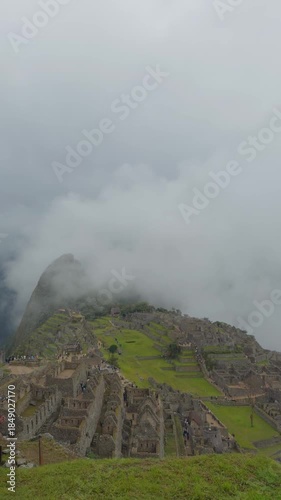 Machu Picchu Ancient Ruins Under Low Clouds