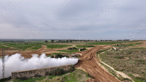 Tableau sur toile Aerial IDF Merkava Tank Deploying Smoke Screen

Drone footage showing an IDF Mer