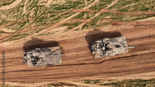 Aerial Top Down Merkava Tanks Gaza Border

Drone footage showing two IDF Merkava tanks from a top down aerial view near the Gaza border in 2024.
