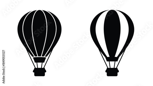 Two black and white hot air balloons with basket designs shown
