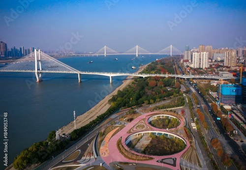 Картината върху платно Modern Bridge and Pink Park Aerial Riverscape City View