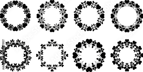 A bundle of black floral heart shaped wreaths on white