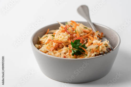 Fresh Coleslaw Salad in Gray Bowl on White Background, Healthy Food Concept
