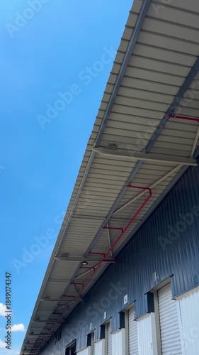 warehouse roof against blue sky