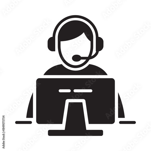 Customer support representative working at a computer with a headset on