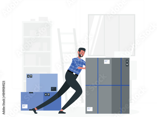 Man pushing large gray box next to blue boxes in warehouse male bearded blue plaid shirt black pants