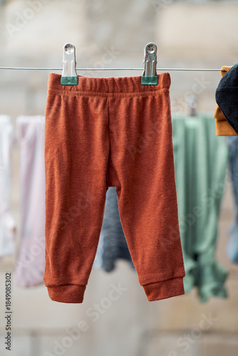 Infant pants hanging with blurred background