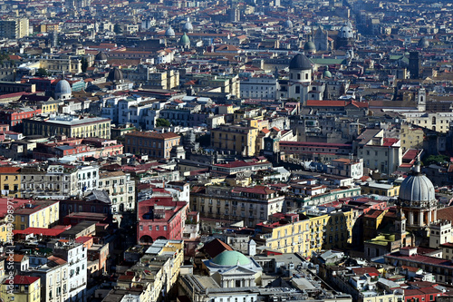 Aerial view of Naples, Italy. rooftops of residential houses and churches. dense cityscape, built environment. travel and tourism. panoramic view from the hill above the city. colorful skyline.