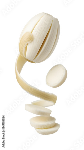 Peeled and sliced white onion with floating pieces isolated on white background, perfect for cooking and food recipes