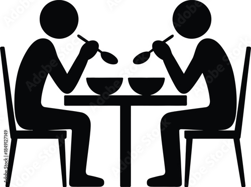 Two people eating soup at a table