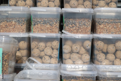 Bird Seed and Feed Balls in Transparent Containers