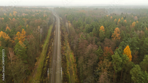 Fényképezés Aerial railway line running through autumn forest