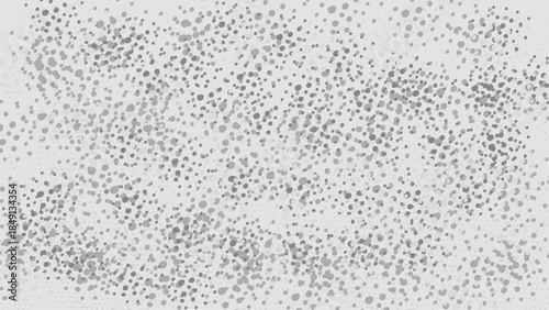 Abstract grayscale dotted pattern on a white background.