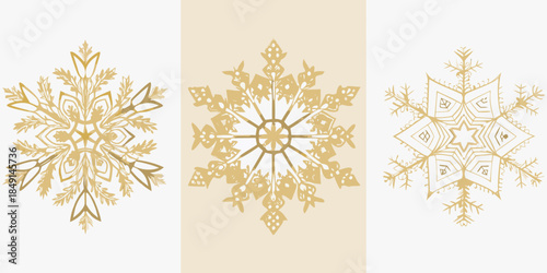 Three golden snowflakes displayed against a simple white and beige background
