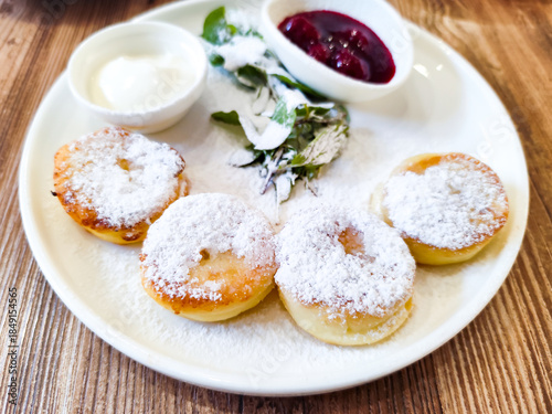 Syrniki, fried Eastern Slavic quark pancakes. homemade Syrniki, a part of Ukranian and Russian cuisine