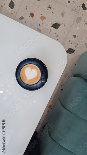 Minimalist flat lay of heart latte art