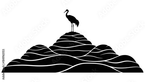 Silhouette of a heron standing atop layered rocky formations against a plain white background