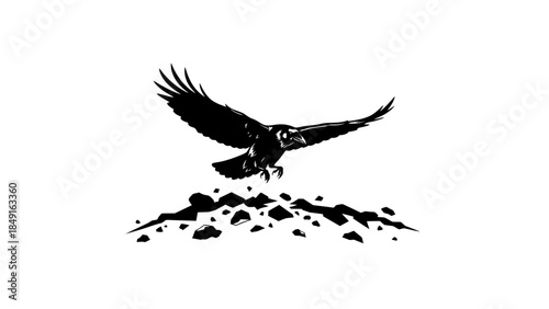 Silhouette of a soaring eagle descending towards rugged terrain with outstretched wings